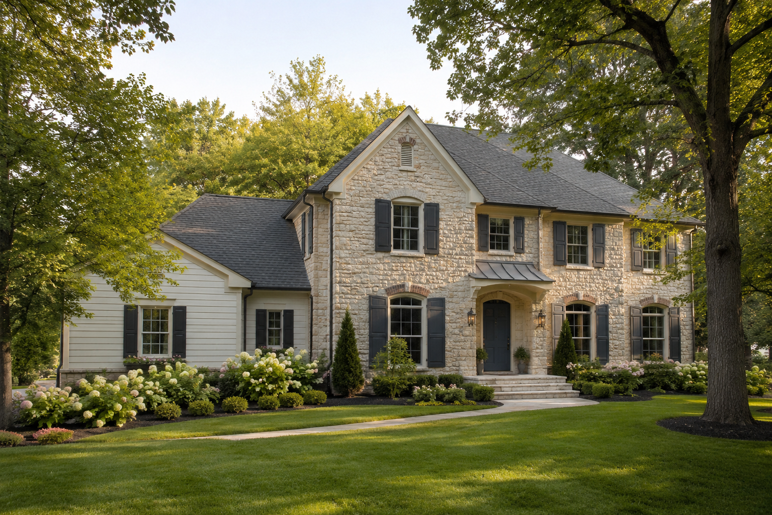 An inviting traditional Midwest home framed by mature trees and hydrangeas